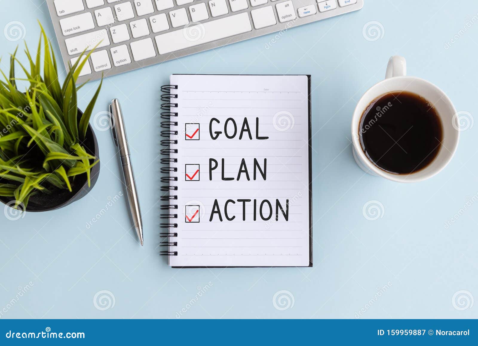 text goal, plan and action on notepad