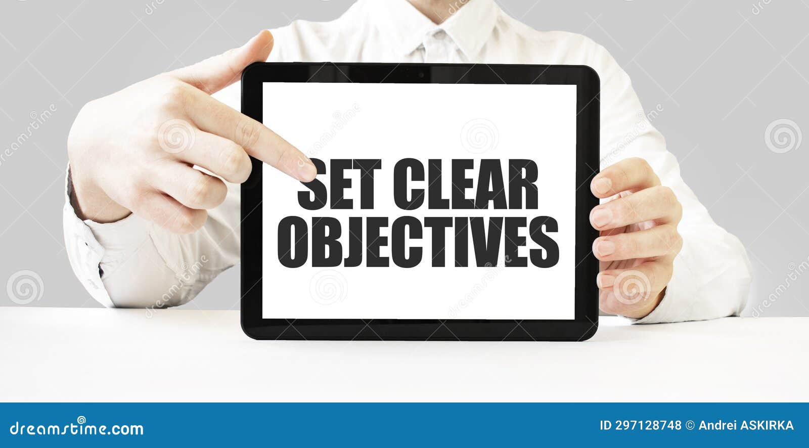 text set clear objectives on tablet display in businessman hands on the white background. business concept