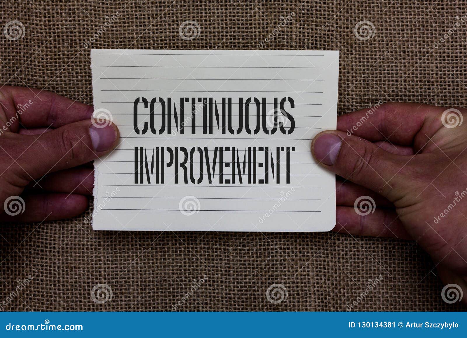 text sign showing continuous improvement. conceptual photo ongoing effort to advance never ending changes man holding