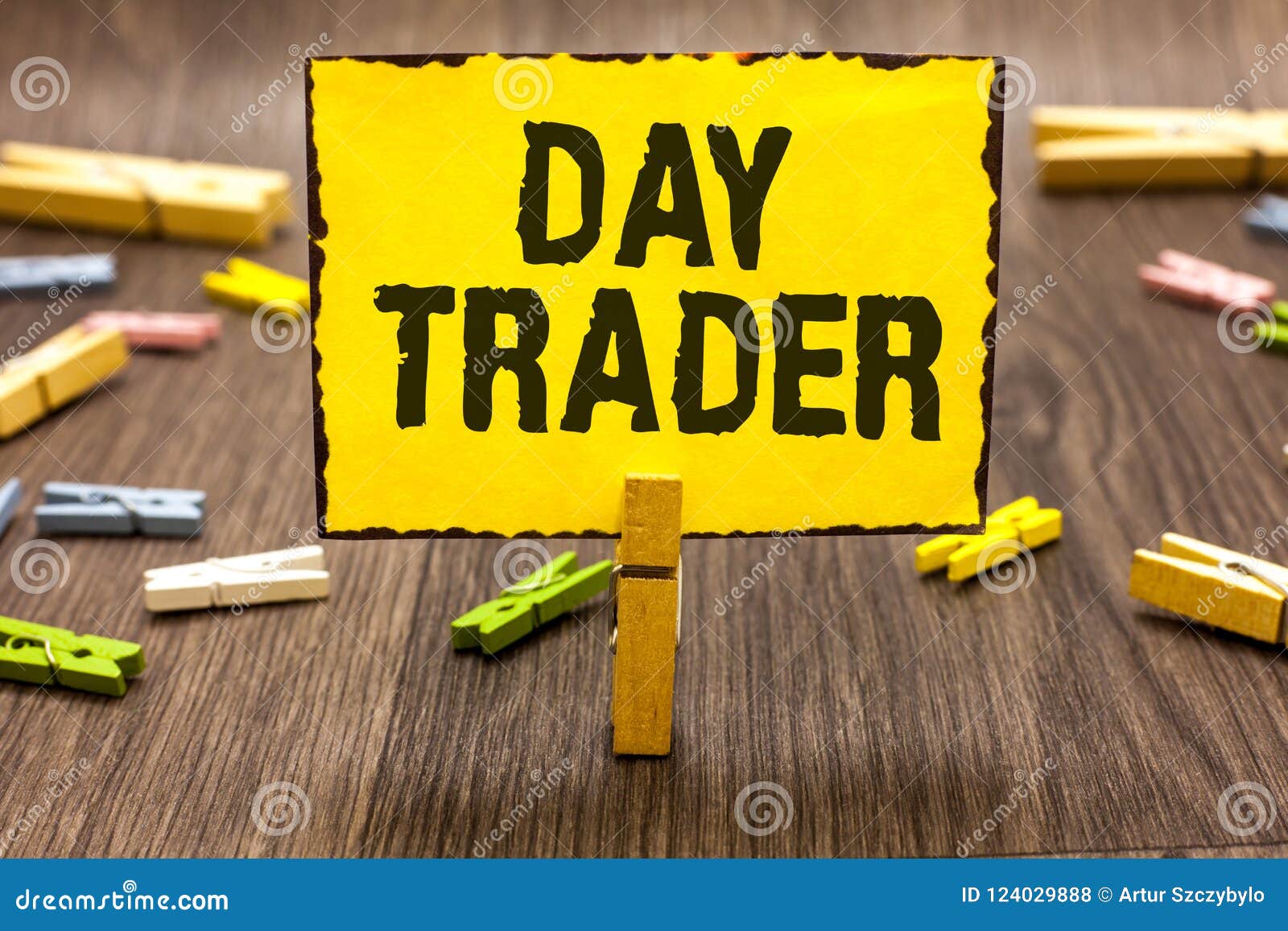 text sign showing day trader. conceptual photo a person that buy and sell financial instrument within the day clothespin holding y