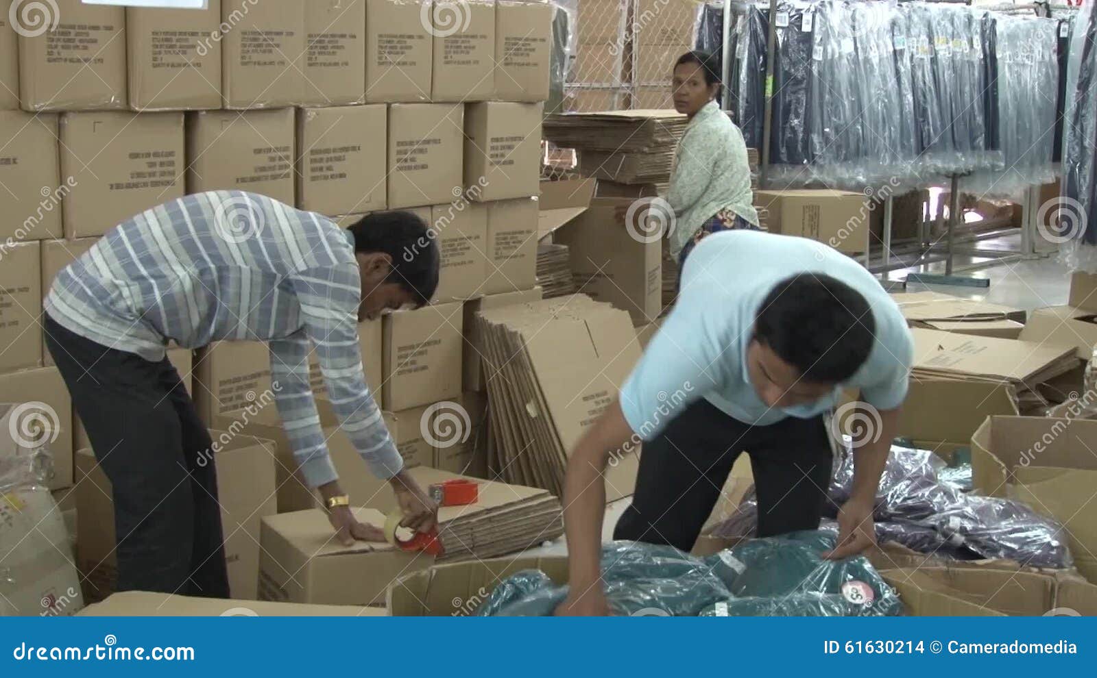 GARMENT FACTORY. Women workers sewing fabric squares