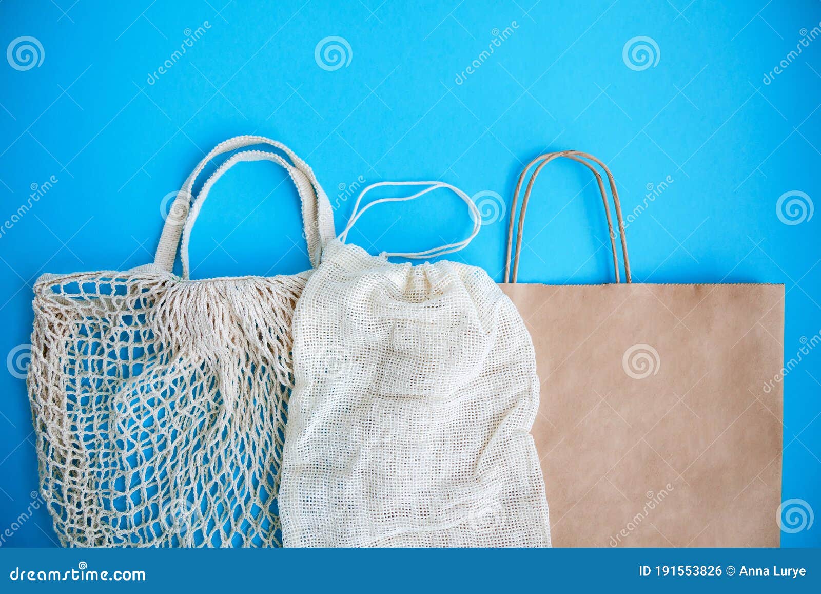 Textile and Paper Eco Bags on Blue Background Stock Photo - Image of ...