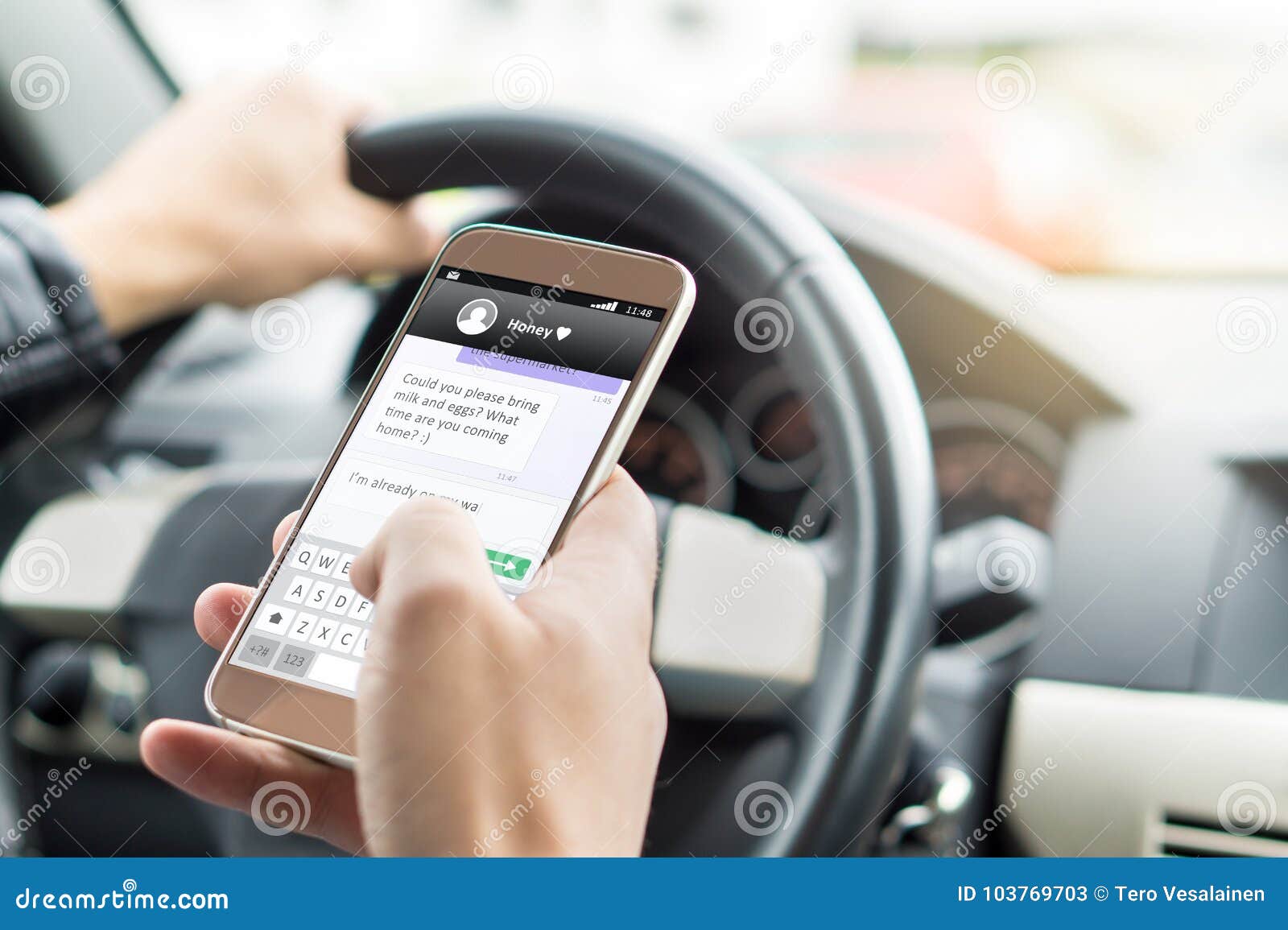 texting while driving car. irresponsible man sending sms.