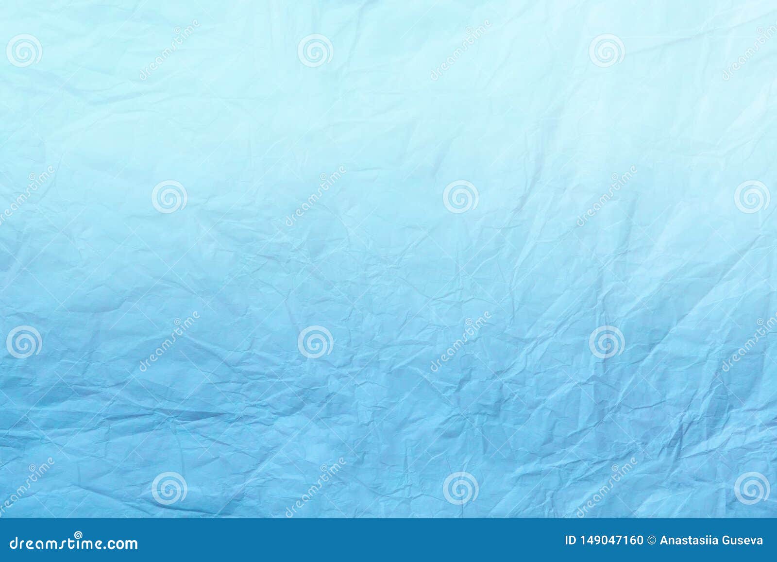Texture of crumpled light blue wrapping paper, closeup. White old  background. Stock Photo