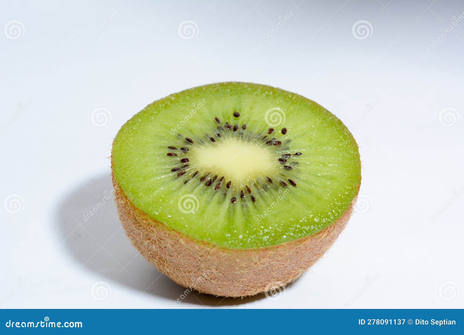 Texture of Kiwi Fruit Cut in Half on White Background Stock Image