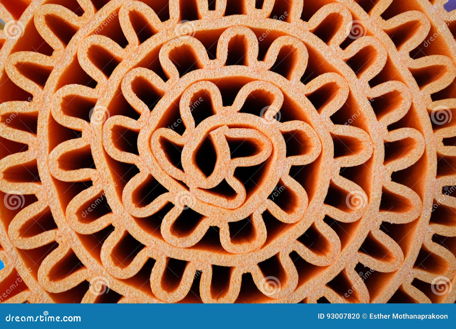 Texture of Orange Foam Sheet Rolled in Wave Shape, Use As Background
