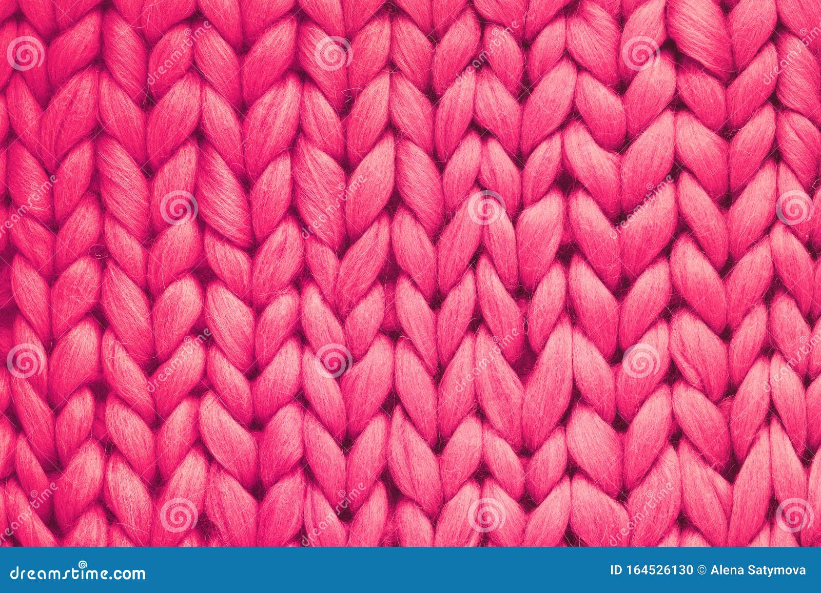 texture of pink wool big knit blanket. large knitting. plaid merino wool. top view