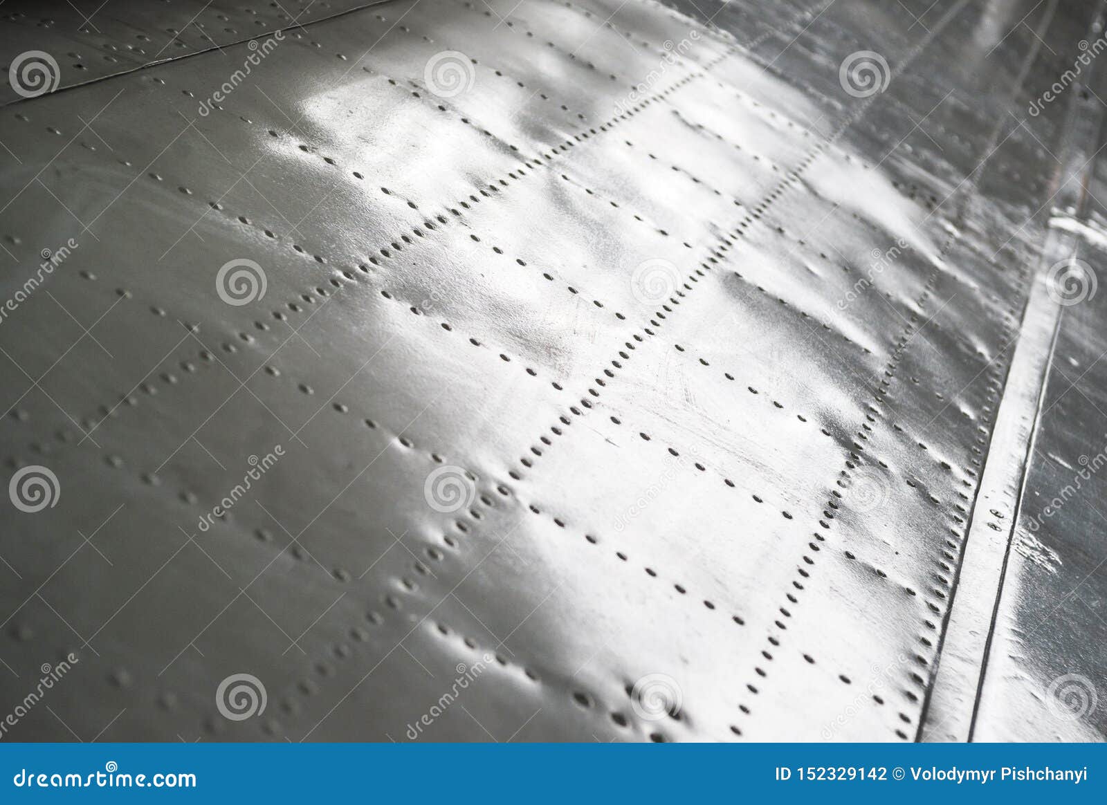 The Texture of the Surface of the Aluminum Wing of the Aircraft with
