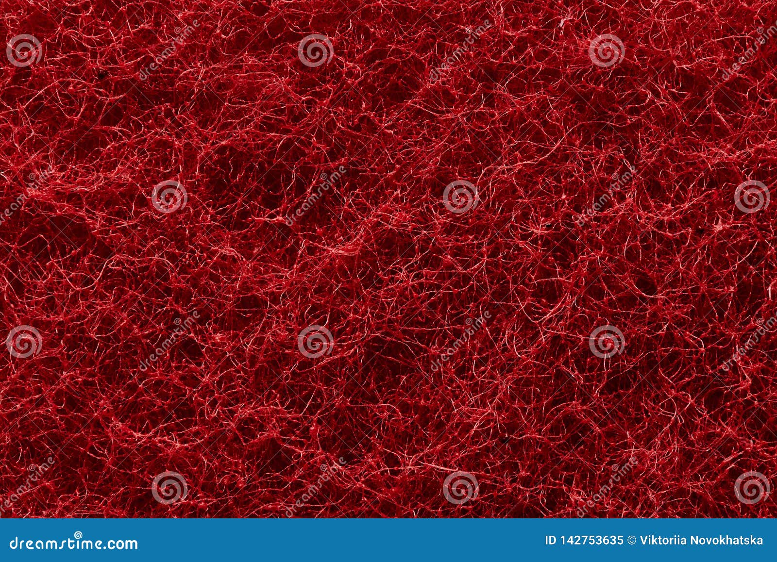 The Texture of the Surface of Interwoven Red Threads of Abrasive