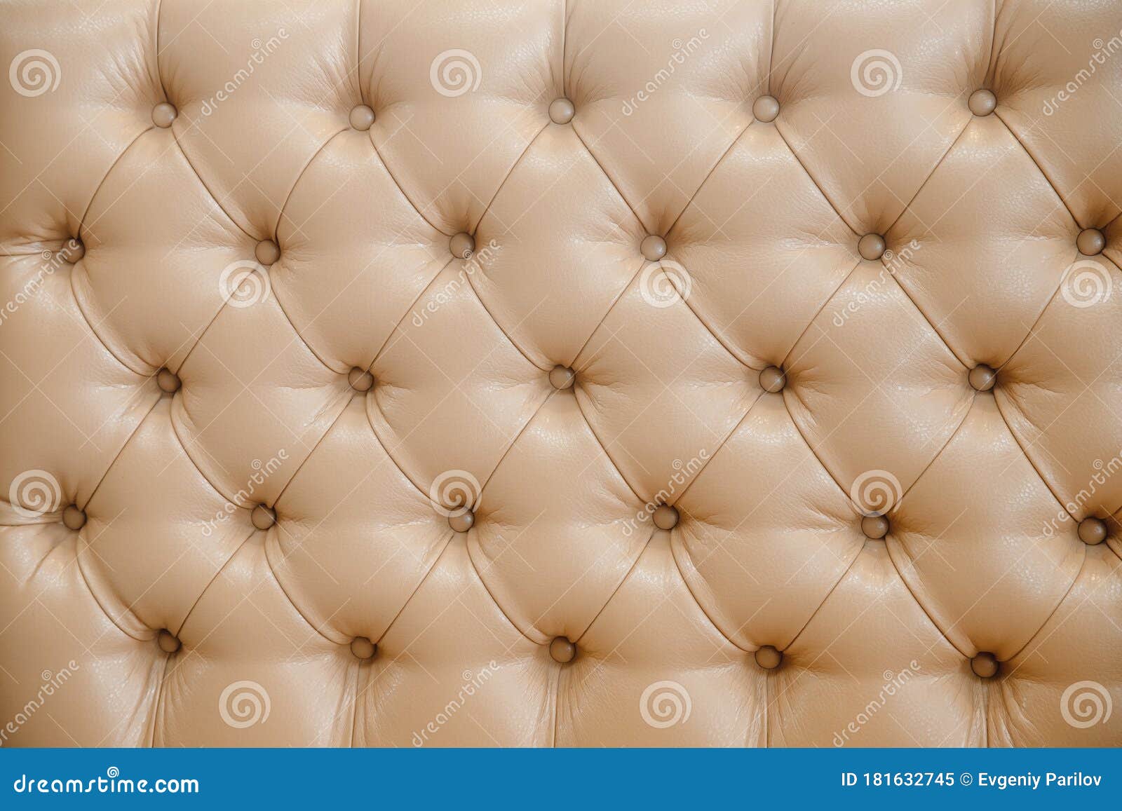 Close-up of patterned beige cushions and small pottery bowl on sofa Stock  Photo - Alamy