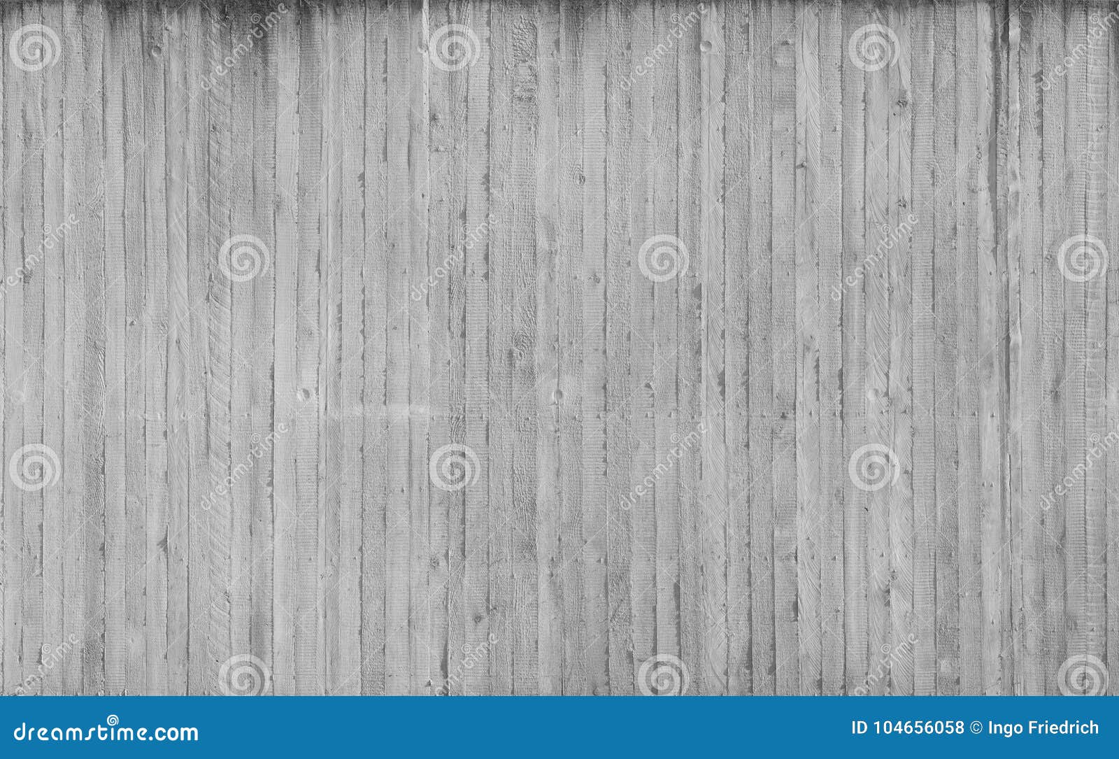 texture of wooden formwork stamped on a raw concrete wall