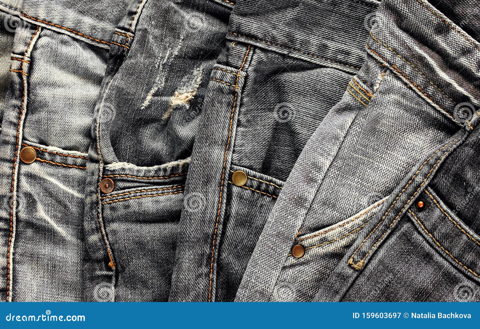 Textured Background of a Variety of Denim Pants in Various Shades of ...