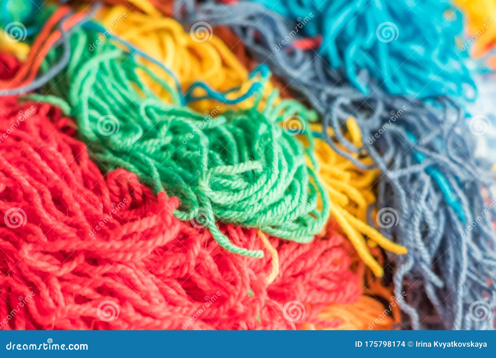 textured background of multi colored bright yarn for kniting nd dyi