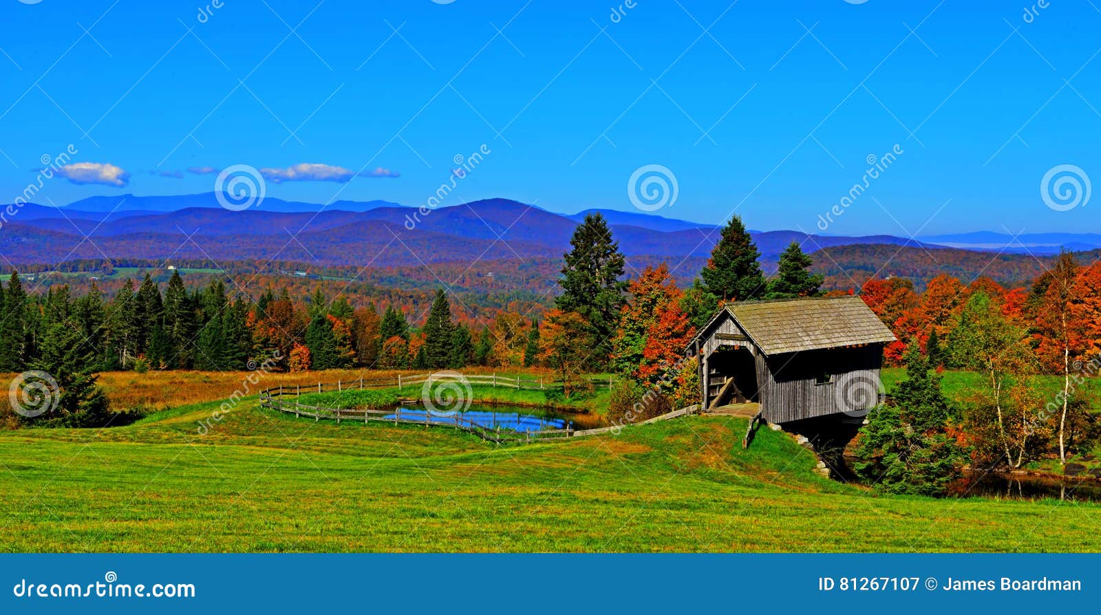 19th century covered bridge in rolling green mountains of vermont hdr.