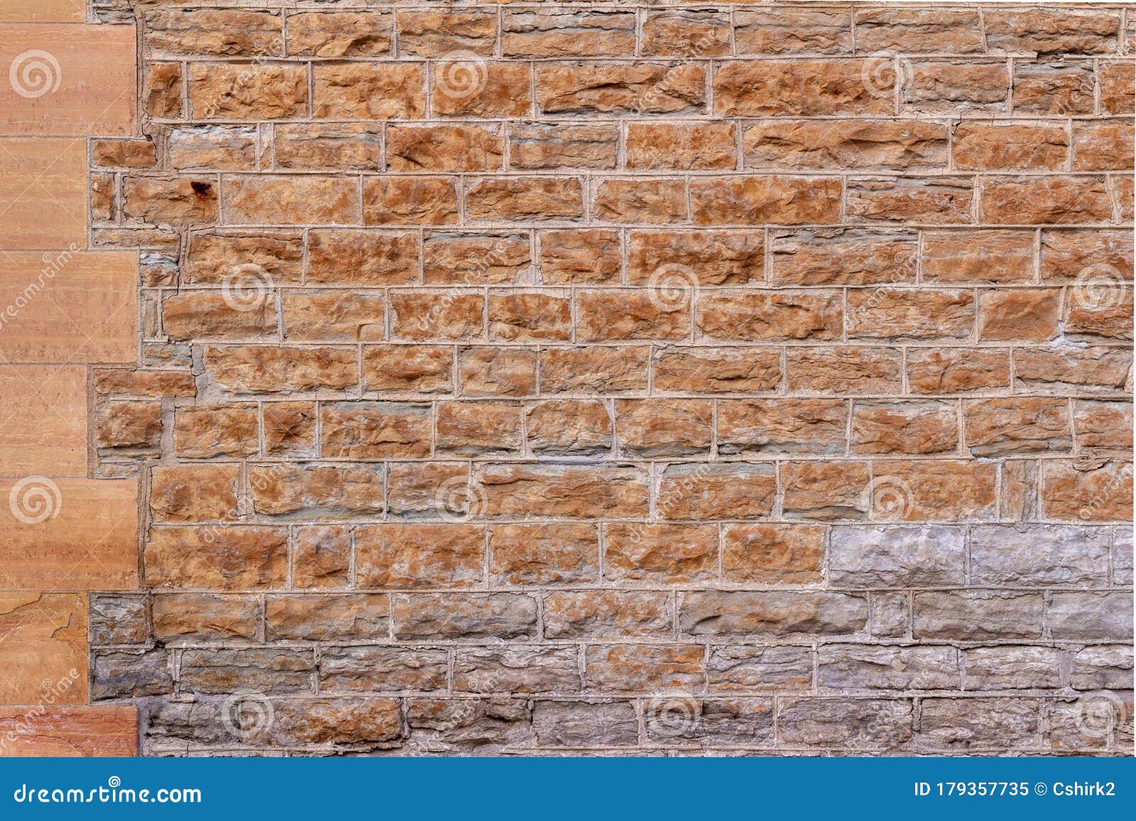 19th century rough limestone block wall texture background with tuckpointed mortar joints