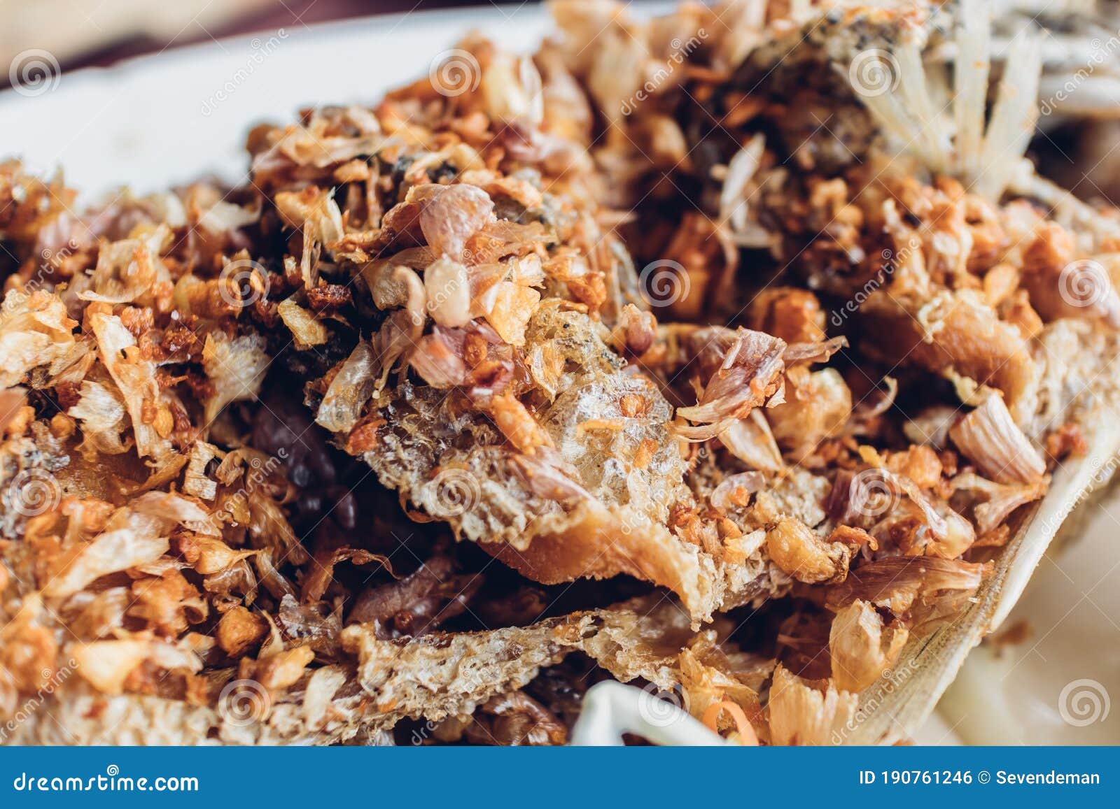 Thai Deep Fried Fish with Garlics and Spicy Sauce. Stock Photo Image