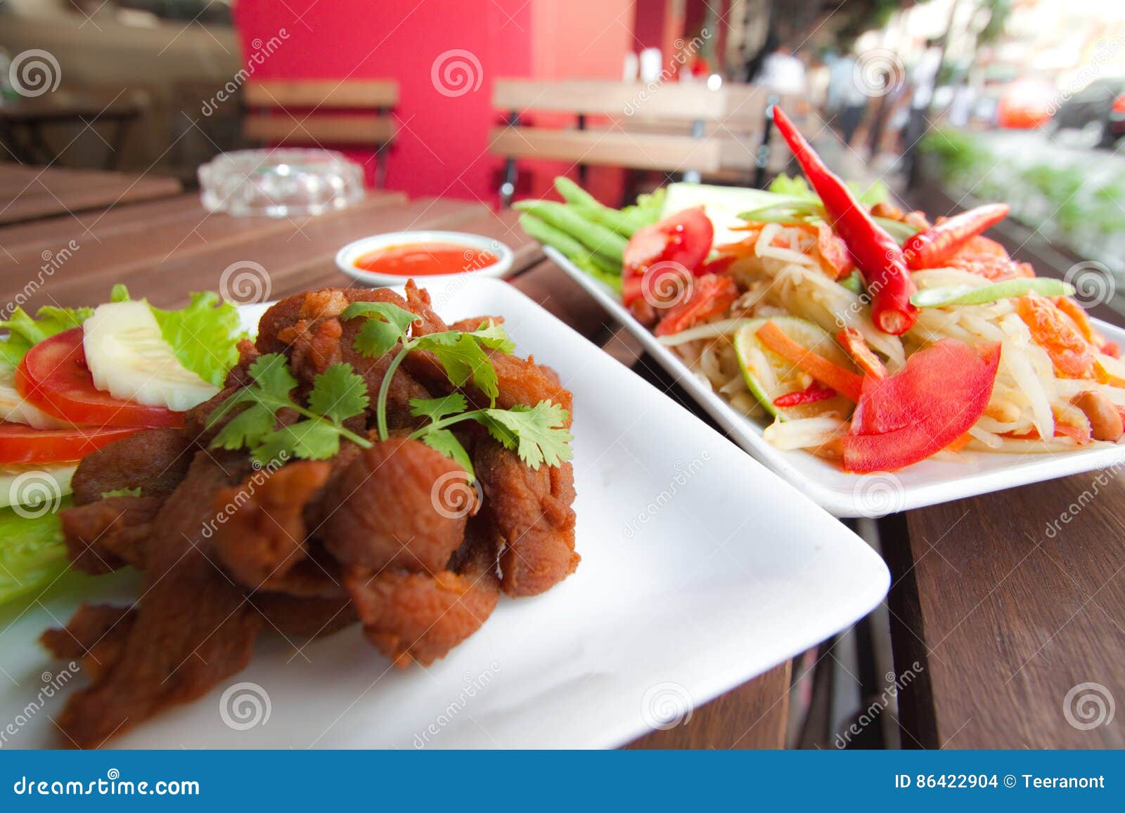 Thai Food fried chicken and Papaya Salad. Popular Thai food is Papaya Salad or `Som Tum` serve with Fried chicken