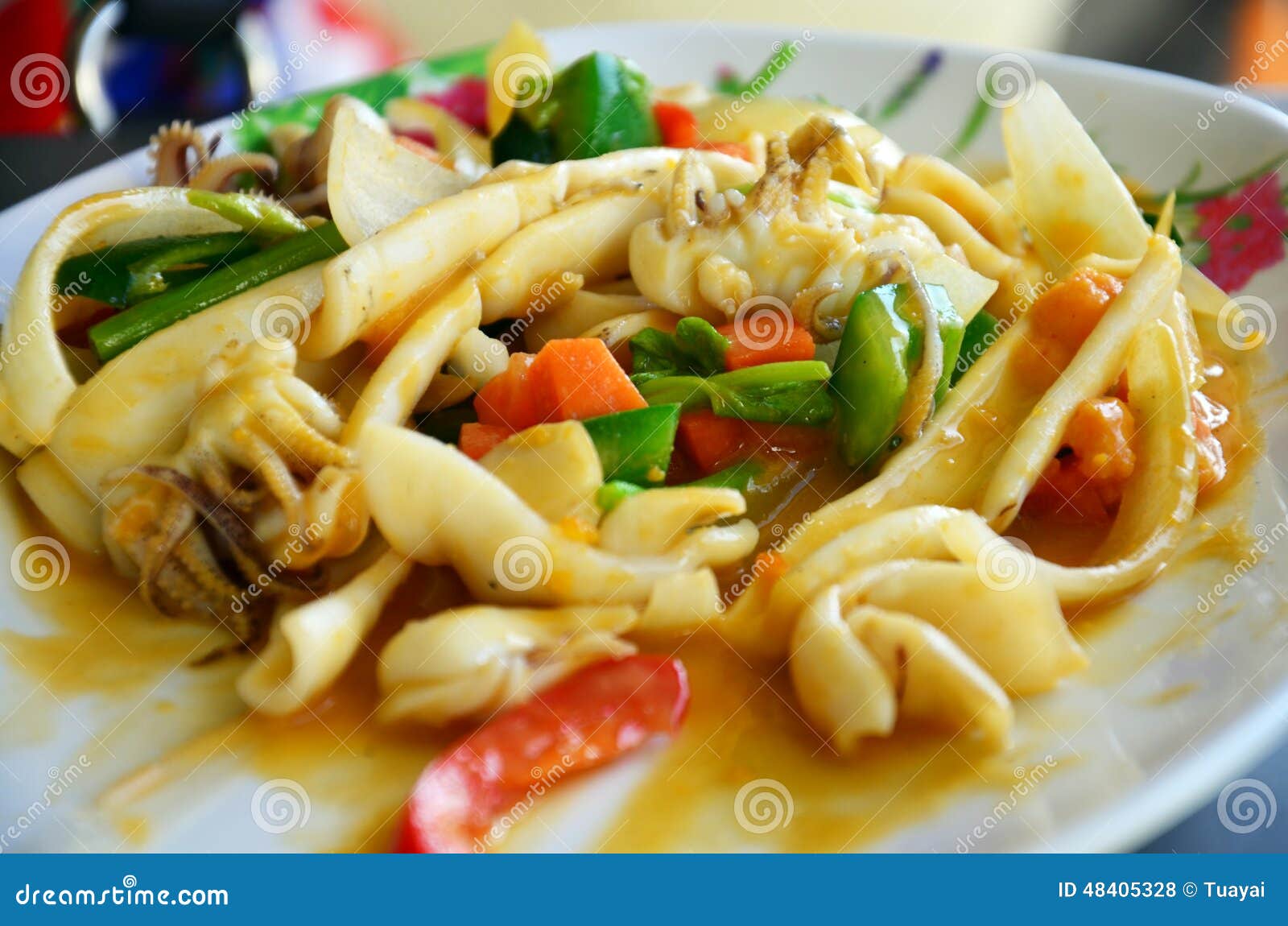 Thai Food Name Stir Fried Squid with Curry and Salted Eggs Stock Photo