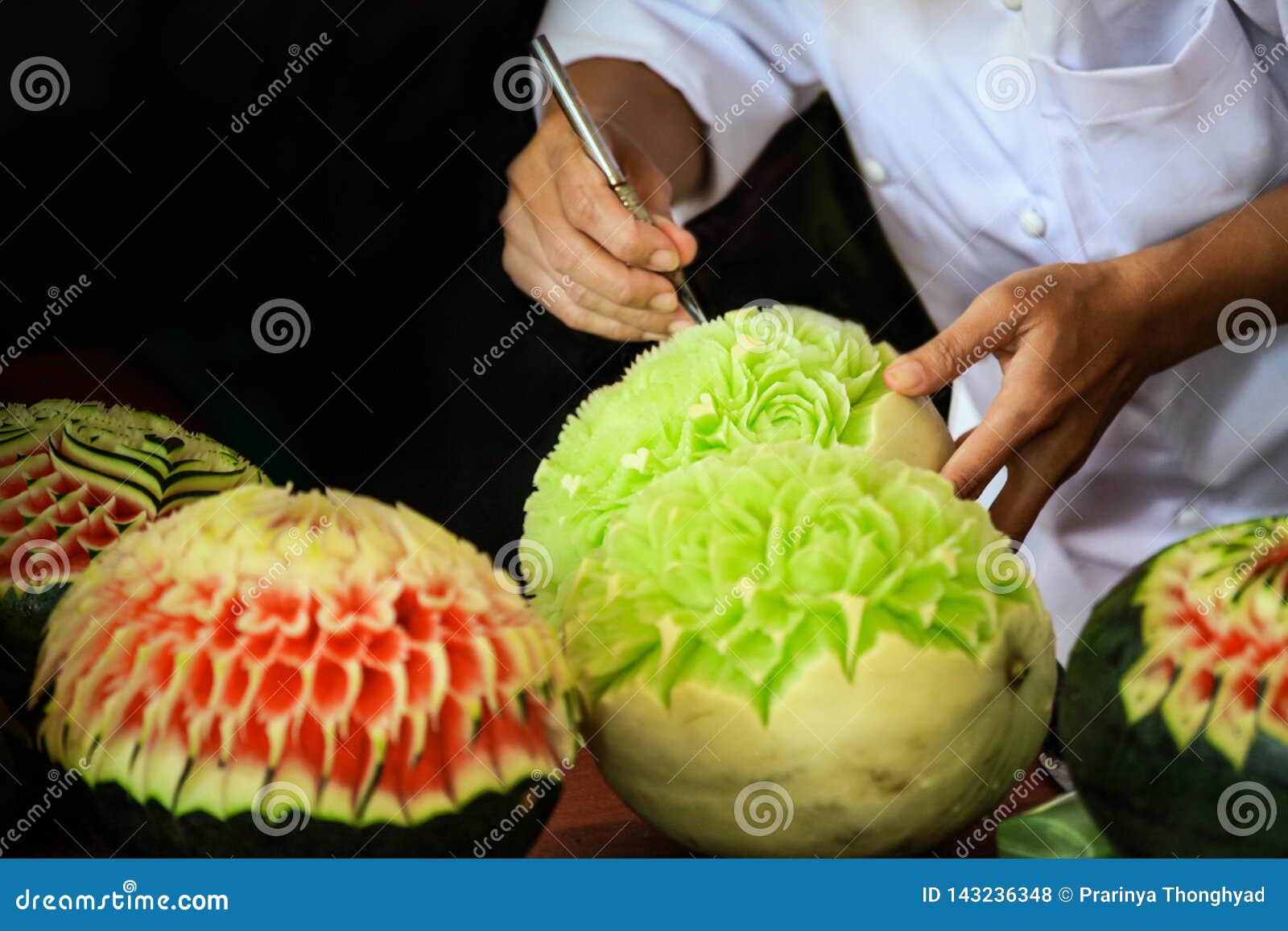thai fruit carving with hand, vegetable and fruit carving
