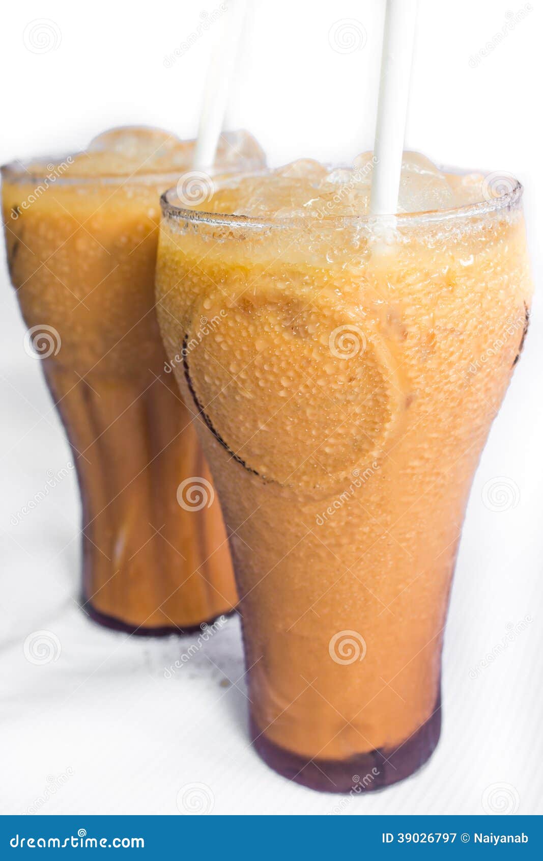 Iced Milk Tea Thai Tea Mixed With Sweetened Condensed Milk And Topped With Milk Foam On Table