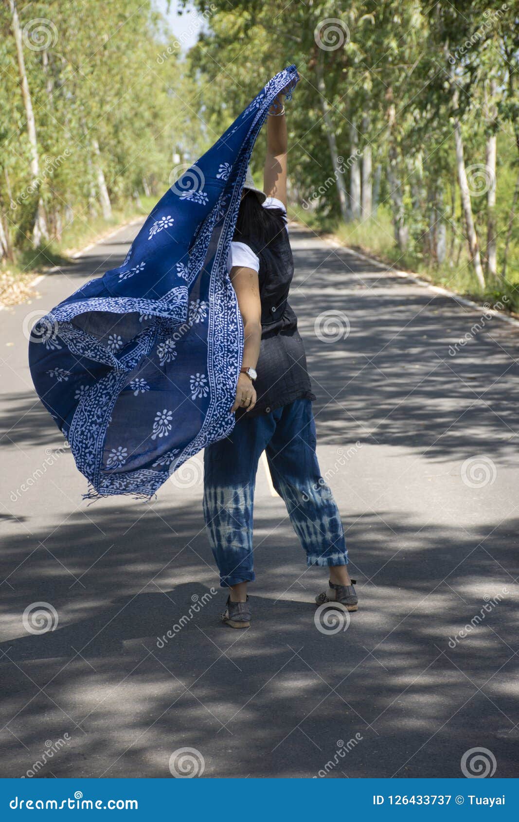 Thai Women Posing Relax And Playing Indigo Tie Dye Fabric Shawl On The Small Street In