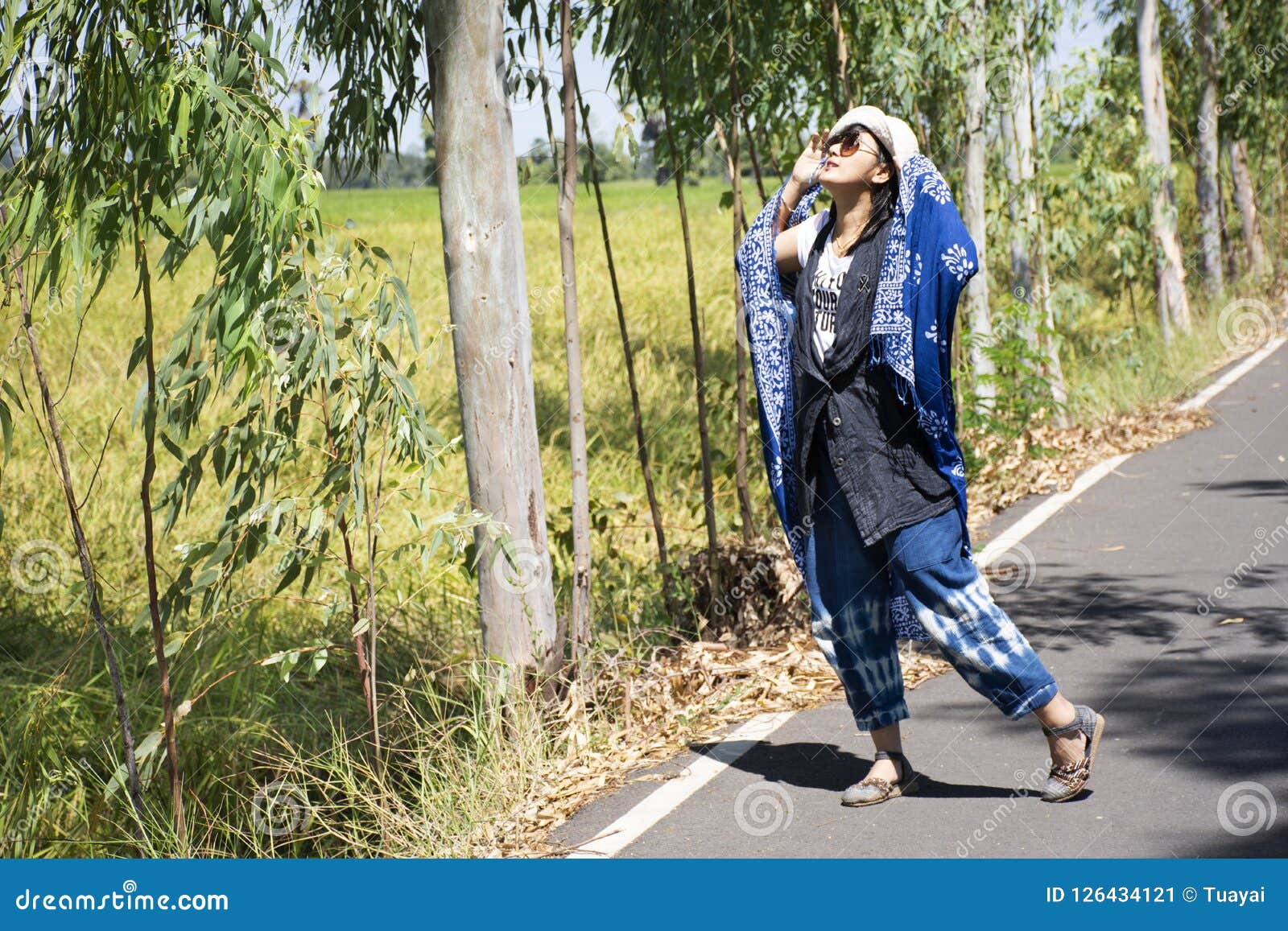 Thai Women Posing Relax And Playing Indigo Tie Dye Fabric Shawl On The Small Street In