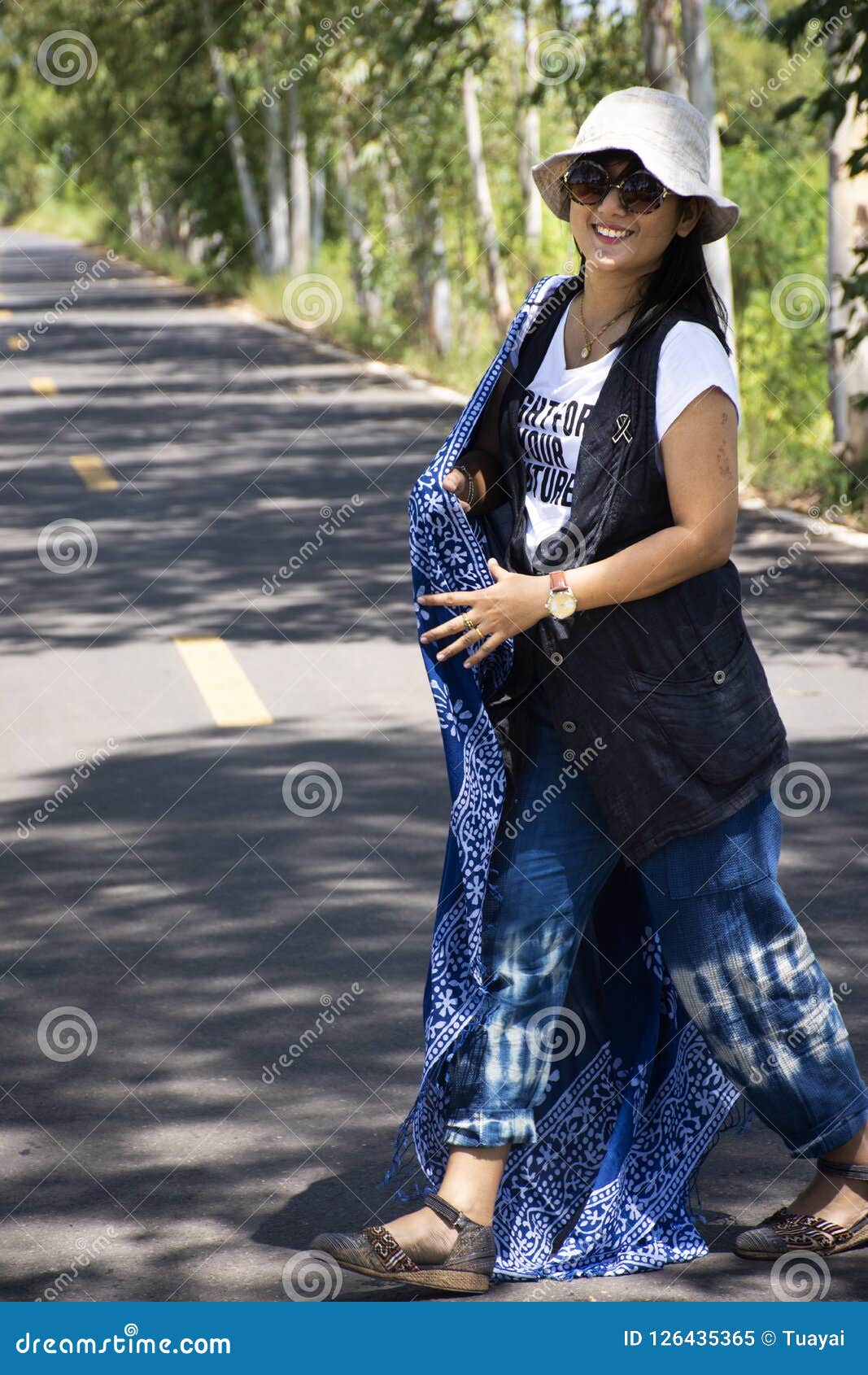 Thai Women Posing Relax And Playing Indigo Tie Dye Fabric Shawl On The Small Street In