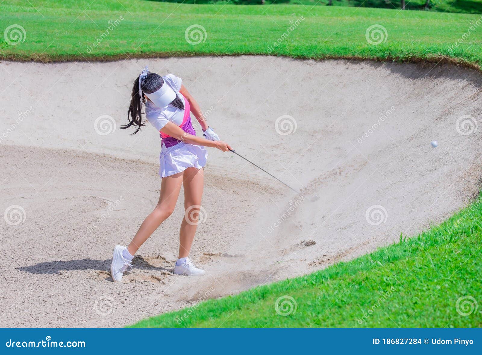Golf players in action during a tournament