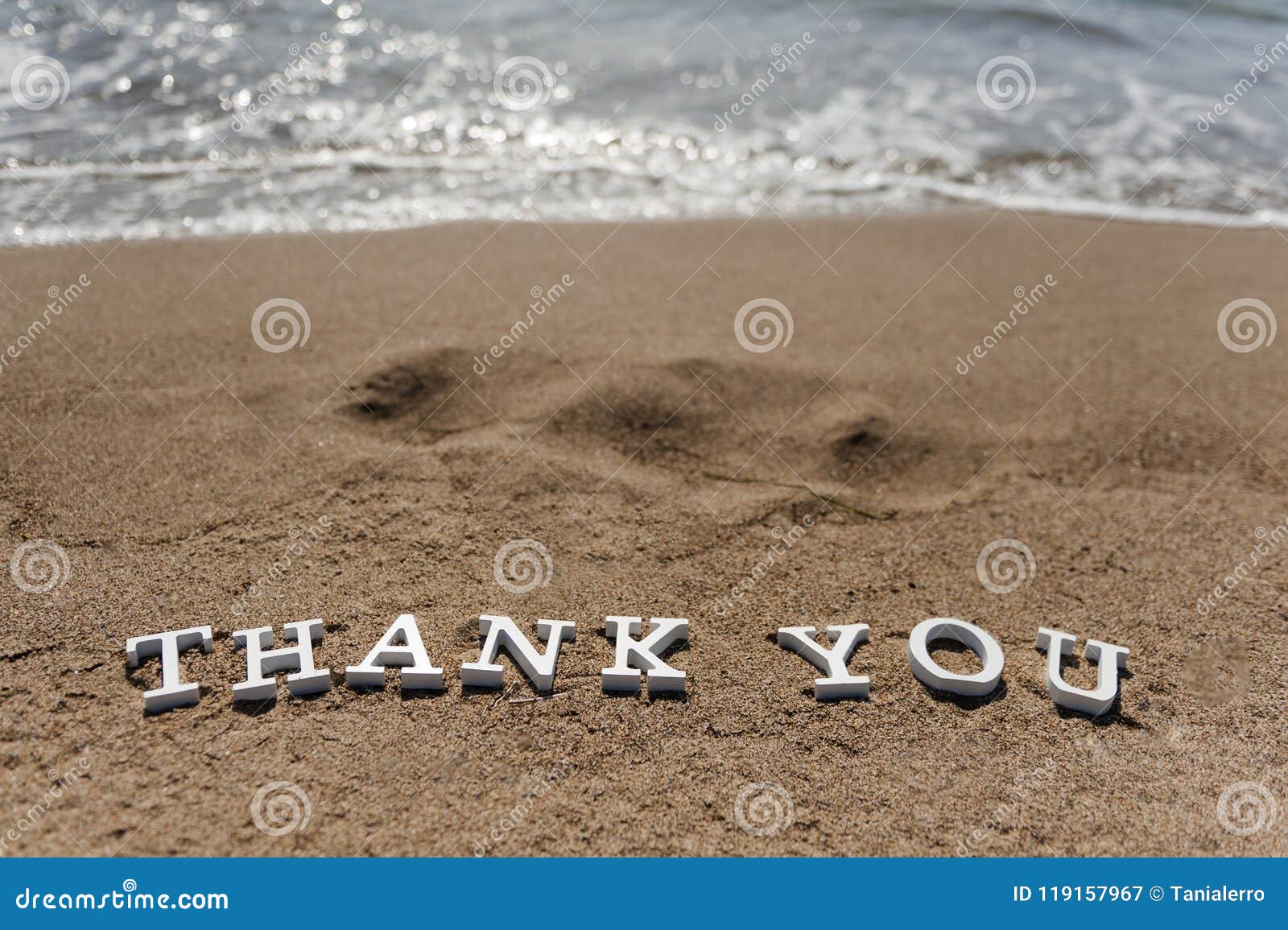 thank you word drawn on the beach sand stock image image of sign thank you sand