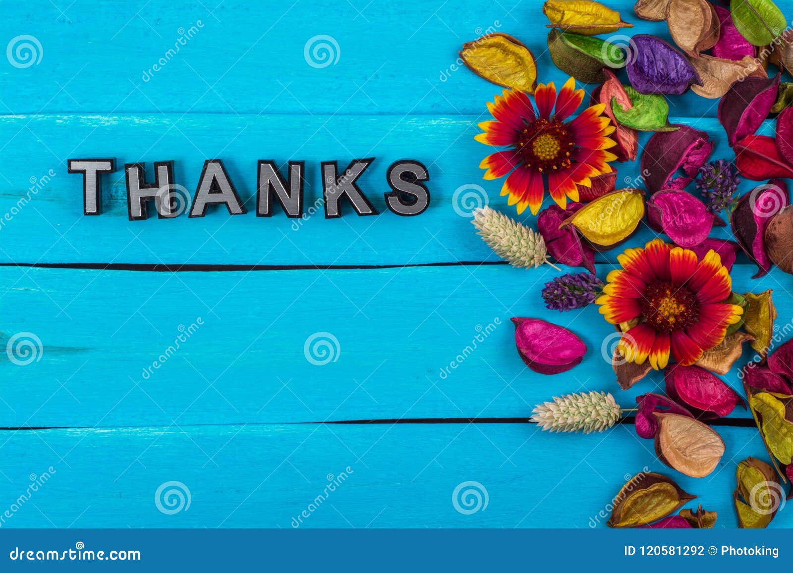thanks word on blue wood with flower