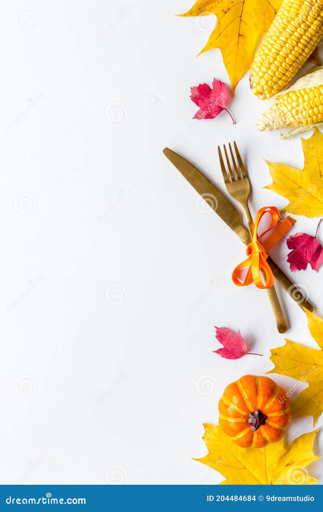 Thanksgiving Day Dinner Table with Autumn Vegetables and Cutlery, Top ...