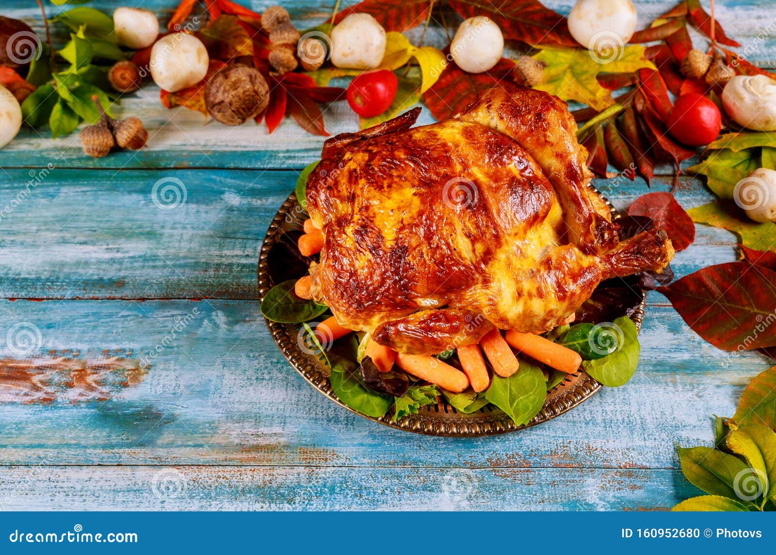 Thanksgiving Day Dinner Table Setting with Whole Roasted Chicken on ...