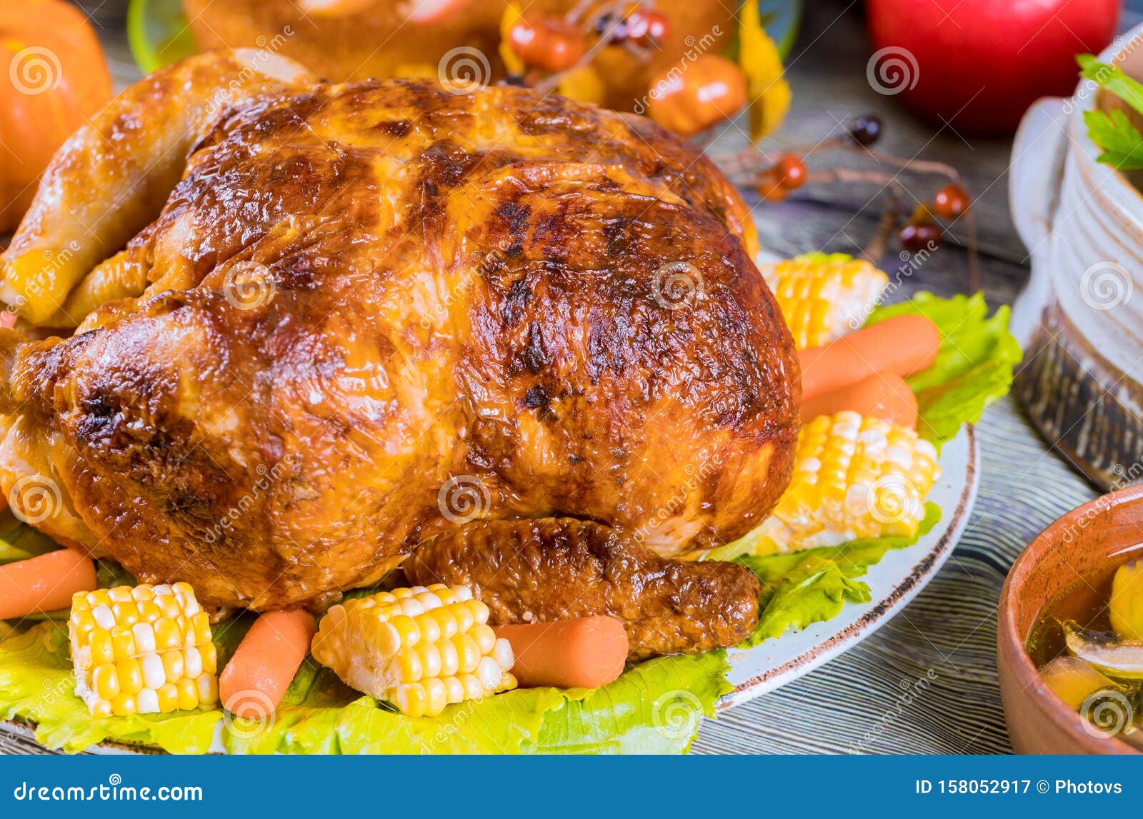 Thanksgiving Dinner with Roasted Turkey Garnished with Corn Stock Image ...