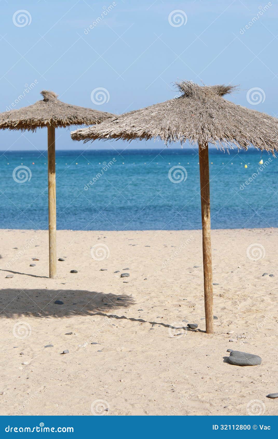 Thatch Beach Umbrellas stock photo. Image of tourism - 32112800