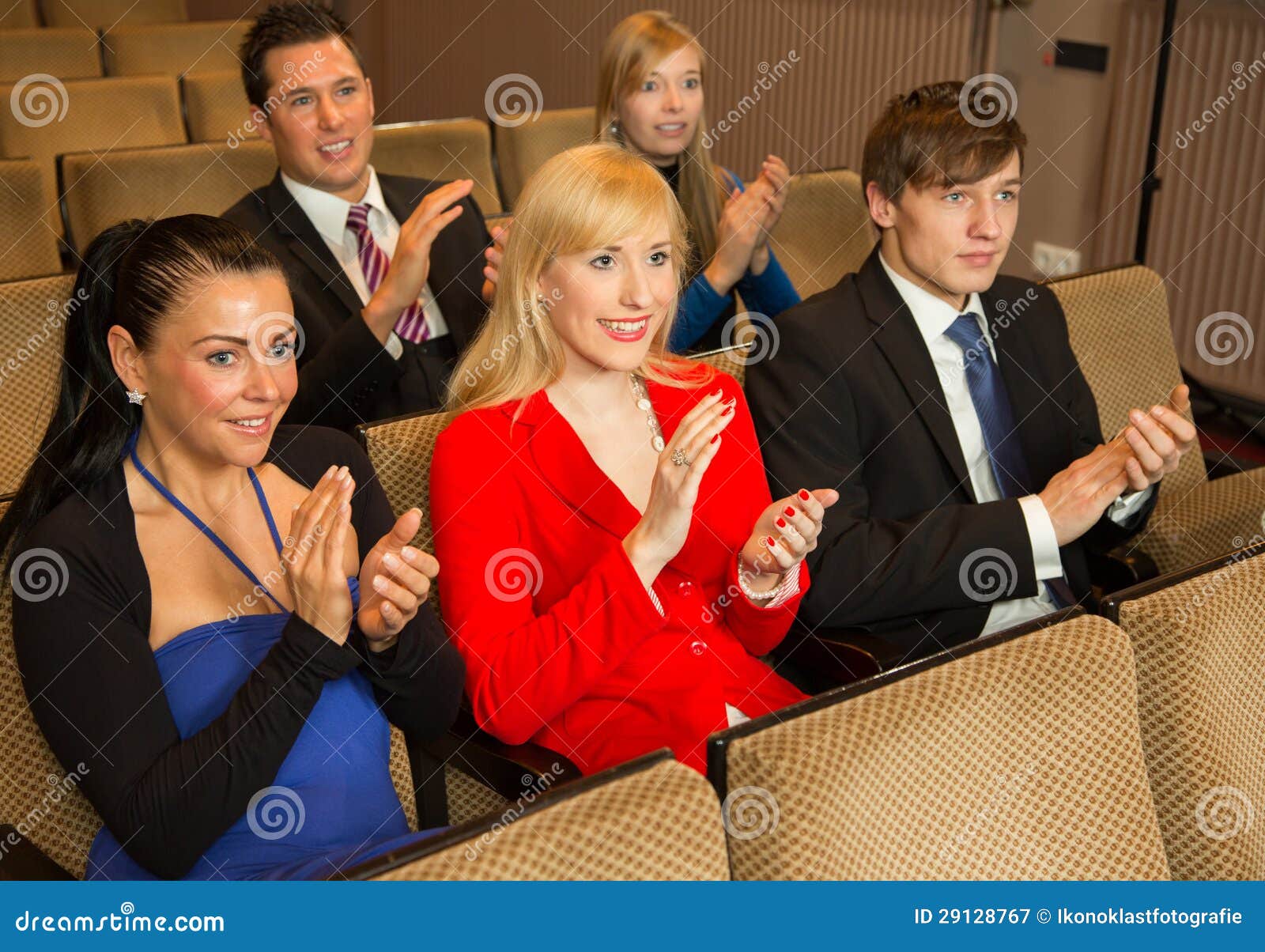 theatre audience clapping and cheering