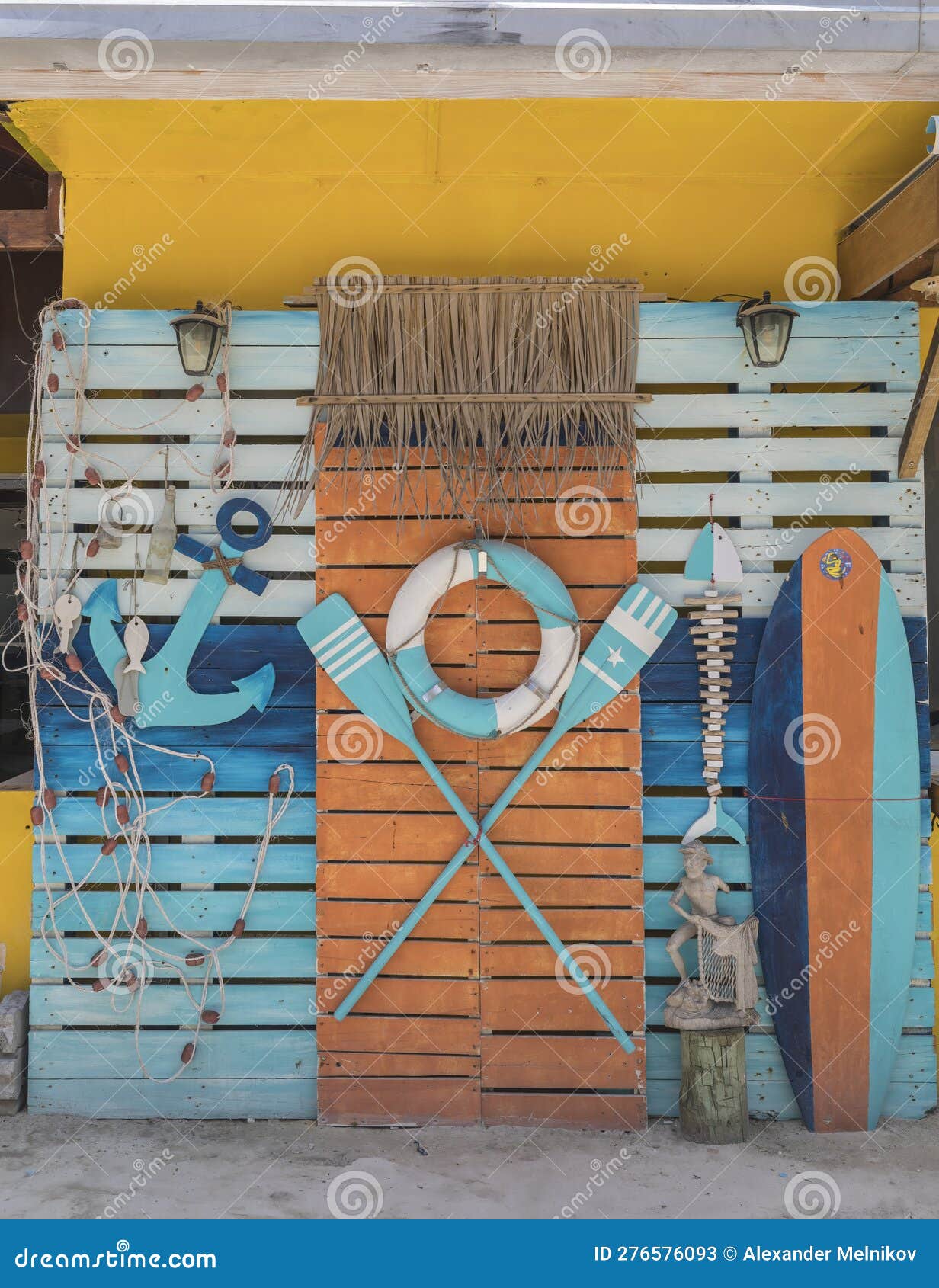 Thematic Corner on the Wall from a Life Buoy, Oars and an Anchor Stock