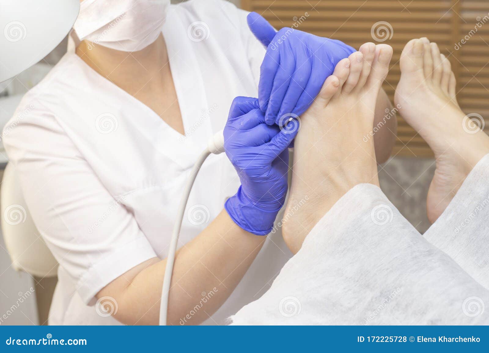 therapeutic pedicure. master podologist does hardware pedicure. visit to the podiatry. foot treatment in the spa.