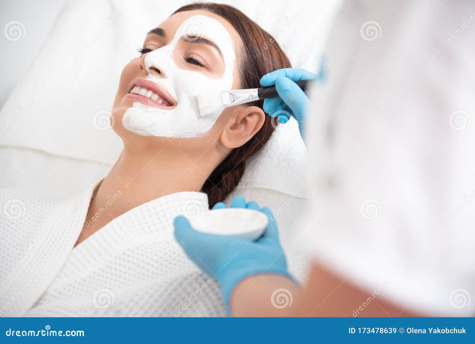 Therapist Applying Face Mask To Happy Female Stock Image Image Of