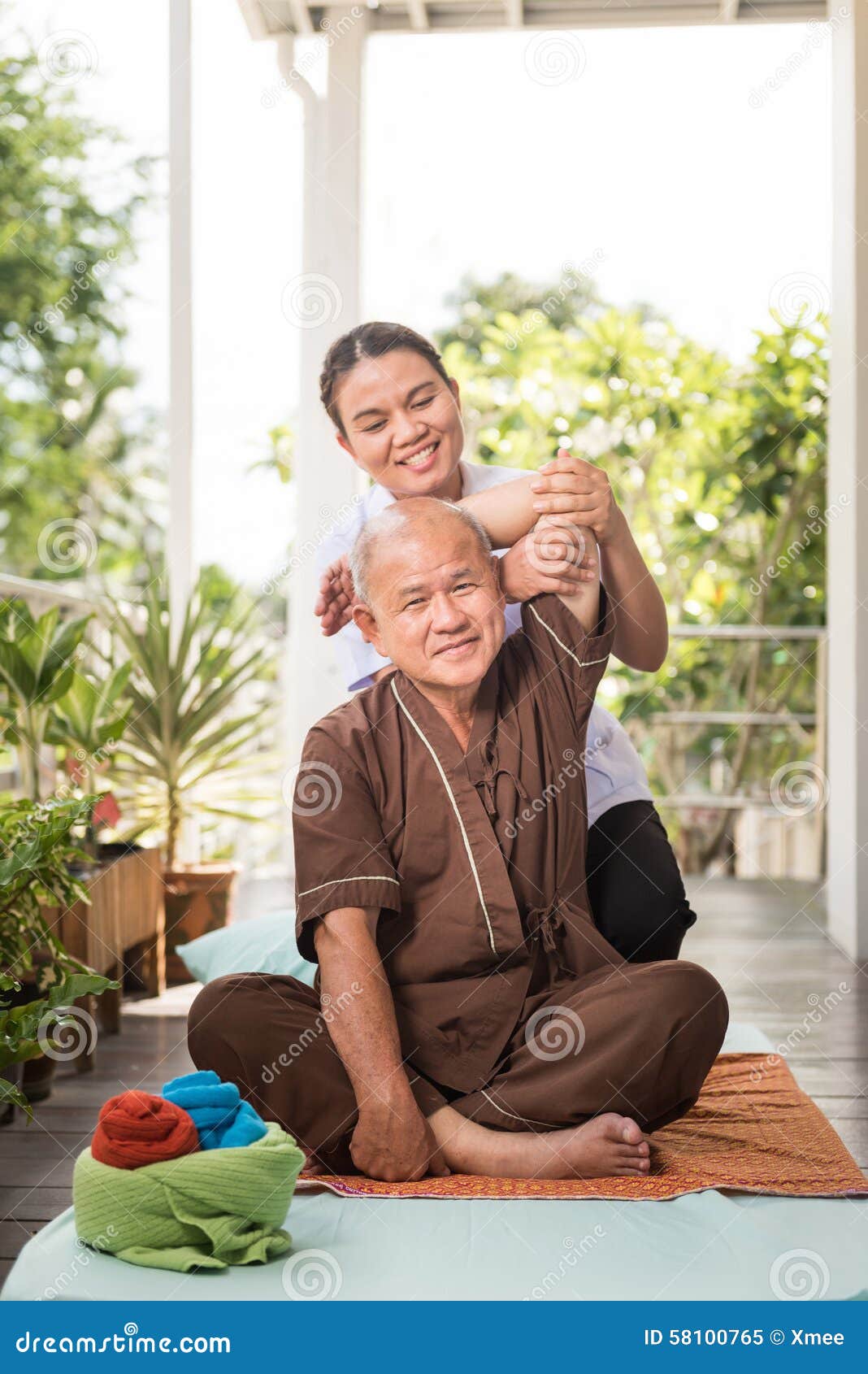 Therapist Giving Massage To Senior Male Patient Stock