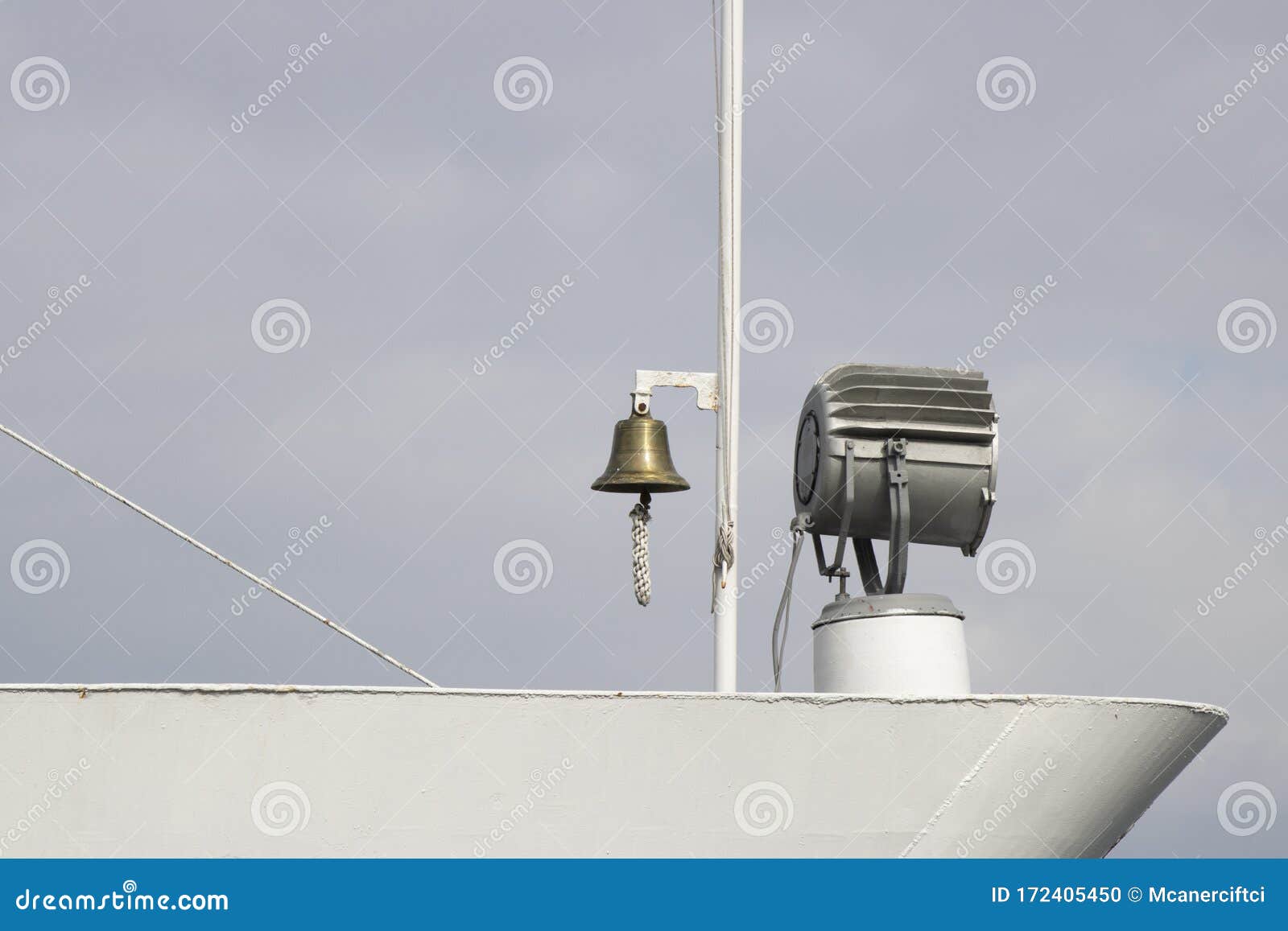 There is a Lighting Projector and Warning Bell on the Ship. Stock Photo Image of code, boat