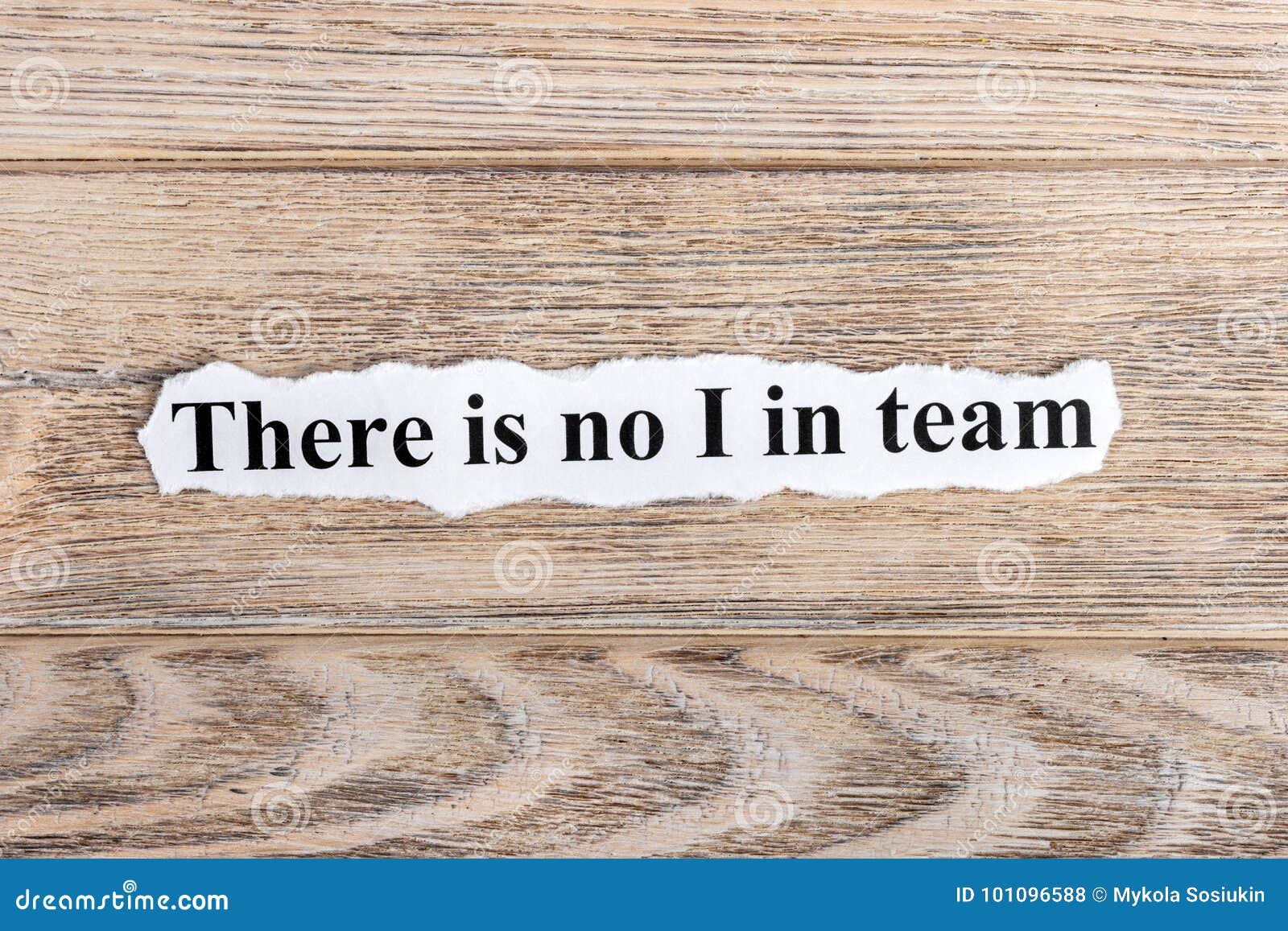 There is No I in TEAM Text on Paper. Word There is No I in TEAM on Torn