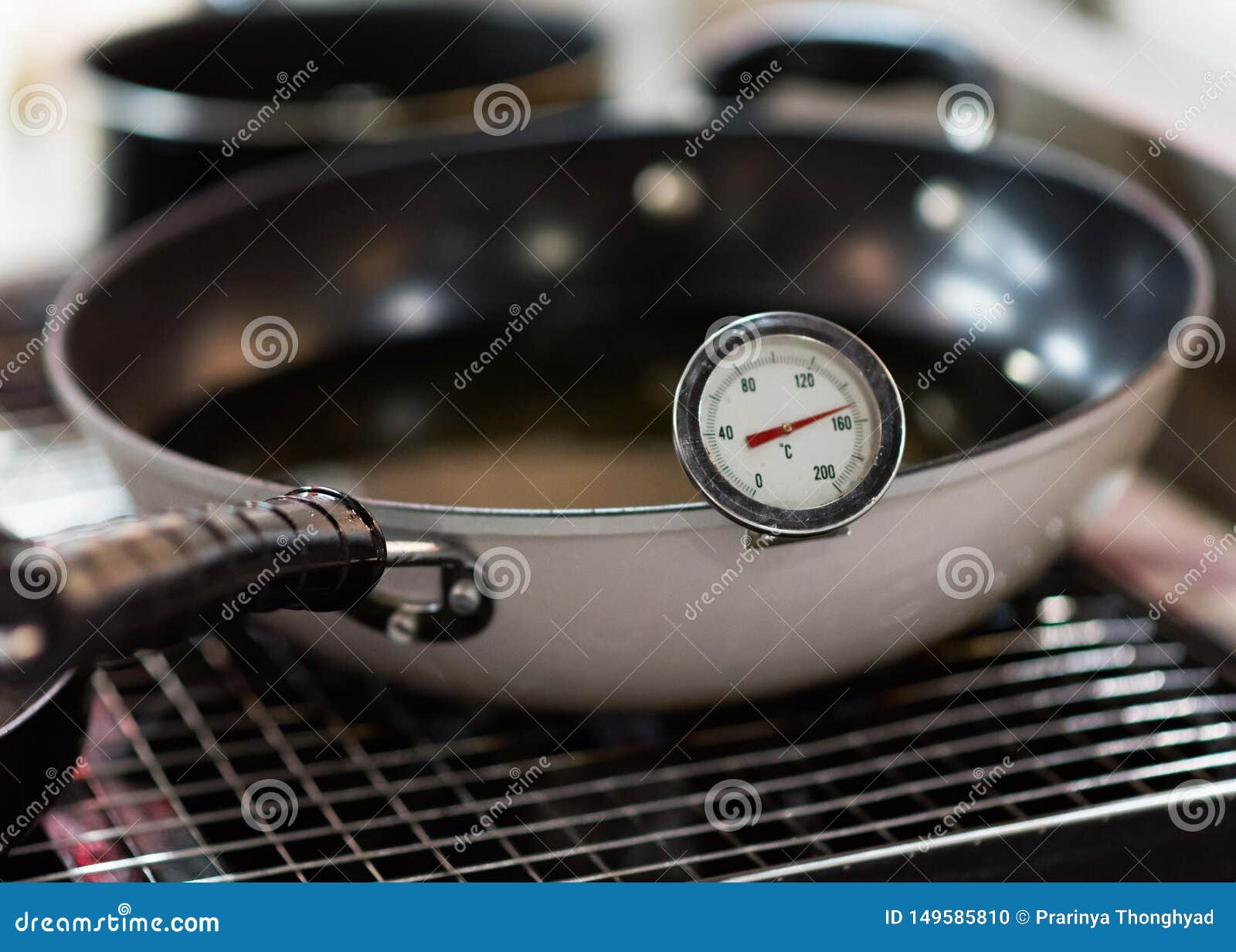 Thermometer for Food, Dial Thermometer in Heating Water Stock Photo