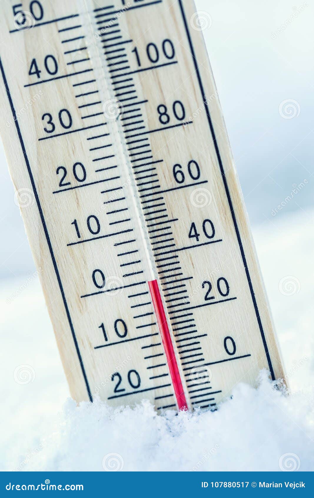 thermometer on snow shows low temperatures zero. low temperature