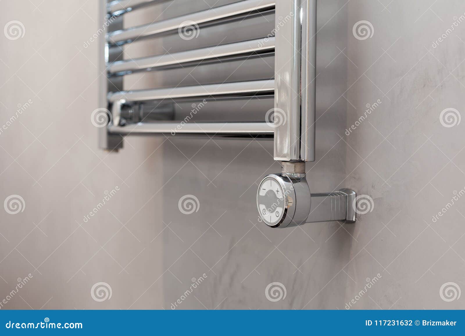 Thermostat for the Towel Warmer in the Bathroom. Stock Photo Image of