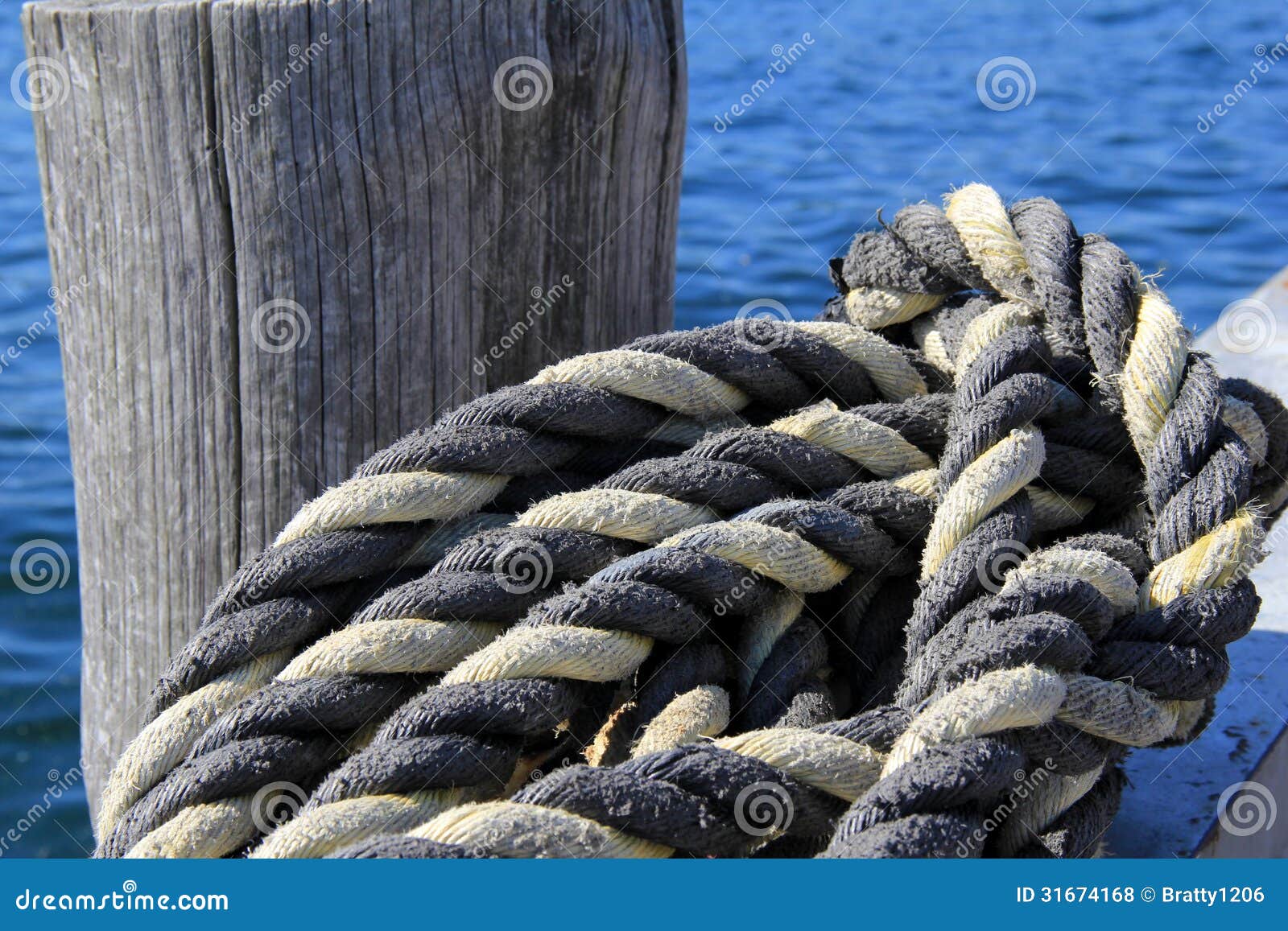 Thick Knotted Rope At The Boat Dock Royalty Free Stock 