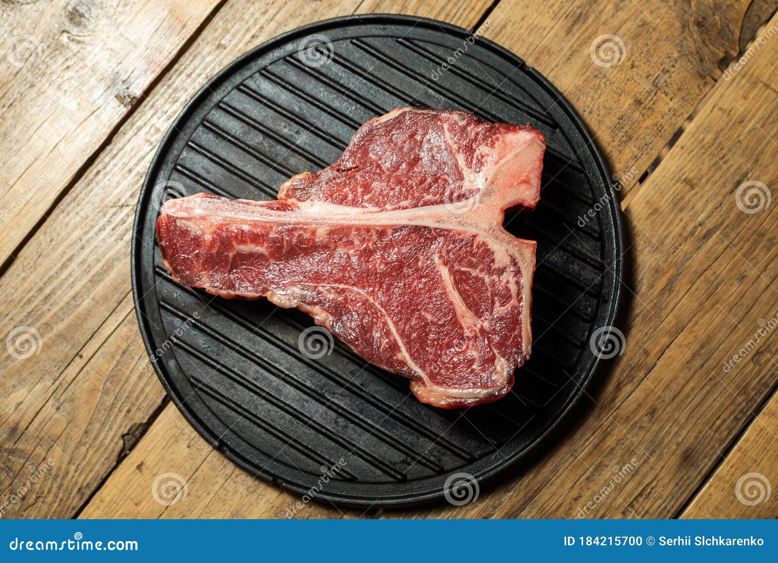 Thick Raw TBone Steak with Seasoning and Rosemary Stock Photo Image