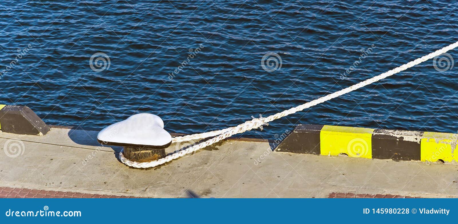 Thick Rope Mooring Bollard on the Wharf with Hawser of Ship Stock Photo -  Image of arrival, pier: 145980228