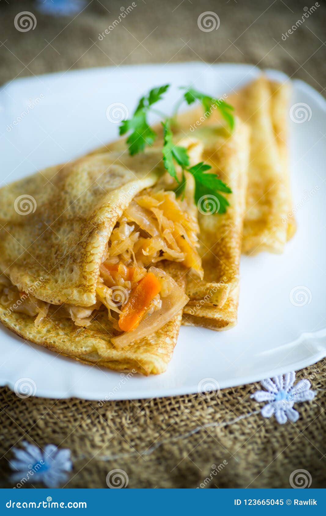 Thin Fried Pancakes Stuffed with Stewed Cabbage in a Plate Stock Image