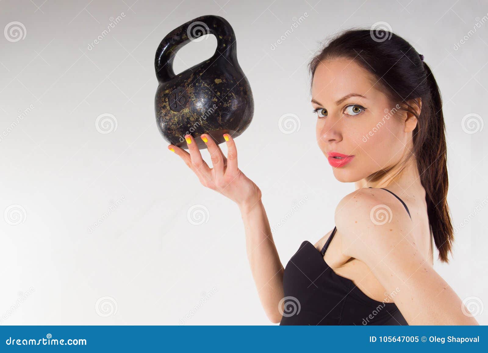 A Thin Girl with a Weight in Her Hand. Stock Image Image of health