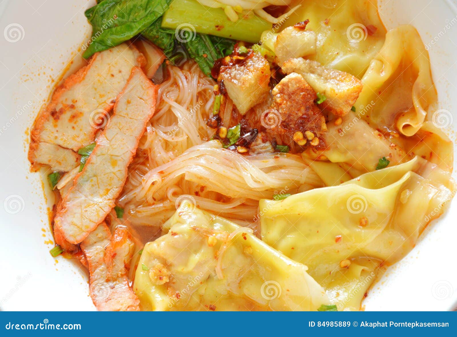 Thin Rice Noodle Topping Dumpling and Slice Barbecue Pork in Soup Stock